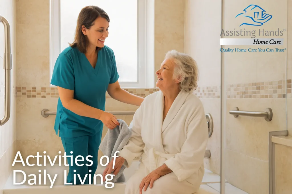Caregiver assisting senior woman in bathroom, emphasizing Activities of Daily Living (ADLs) and supportive home care services by Assisting Hands.